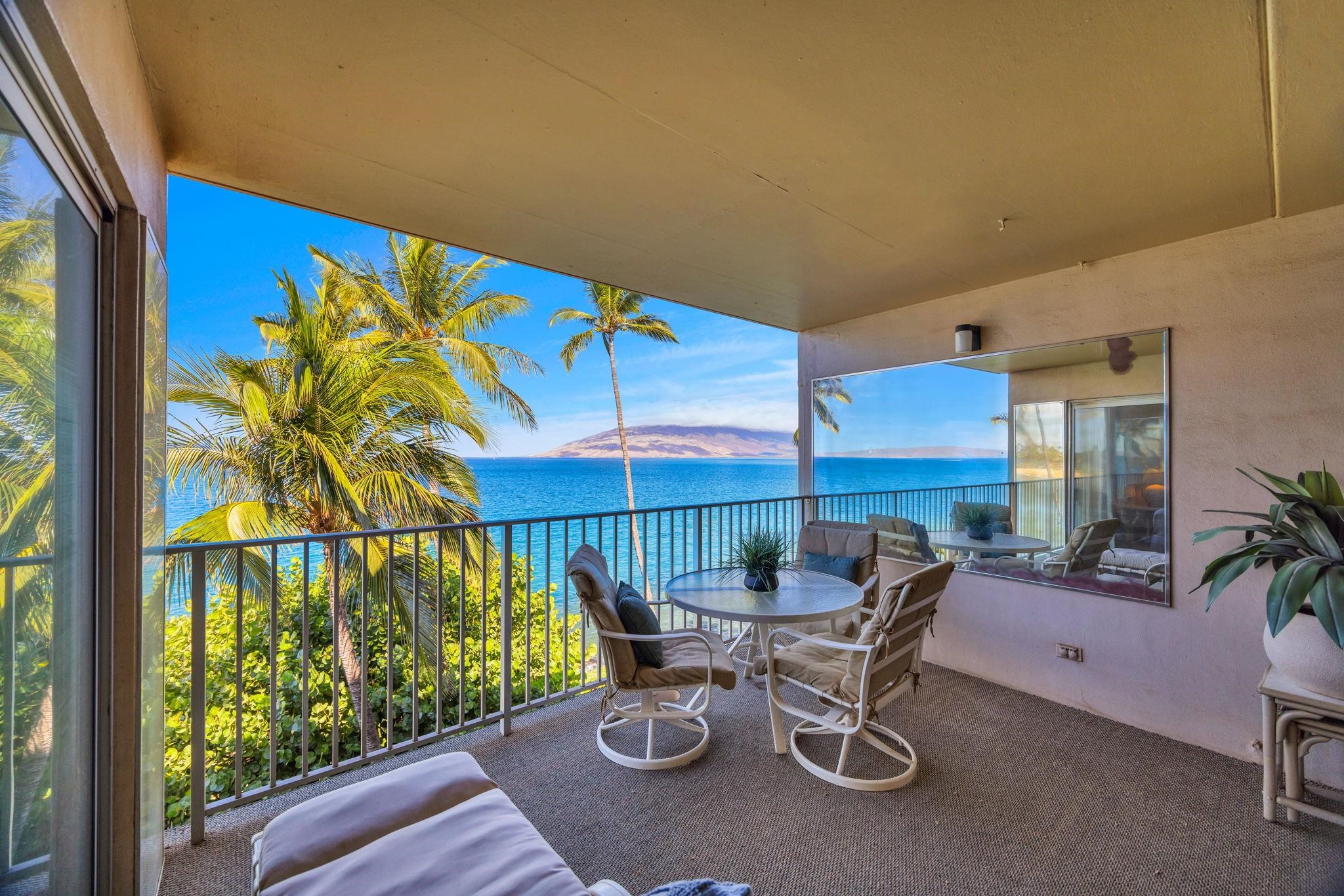 2430 South Kihei Road, Unit 515 Kihei, HI 96753 - Photo 18 of 50 a view of a patio with a table and chairs