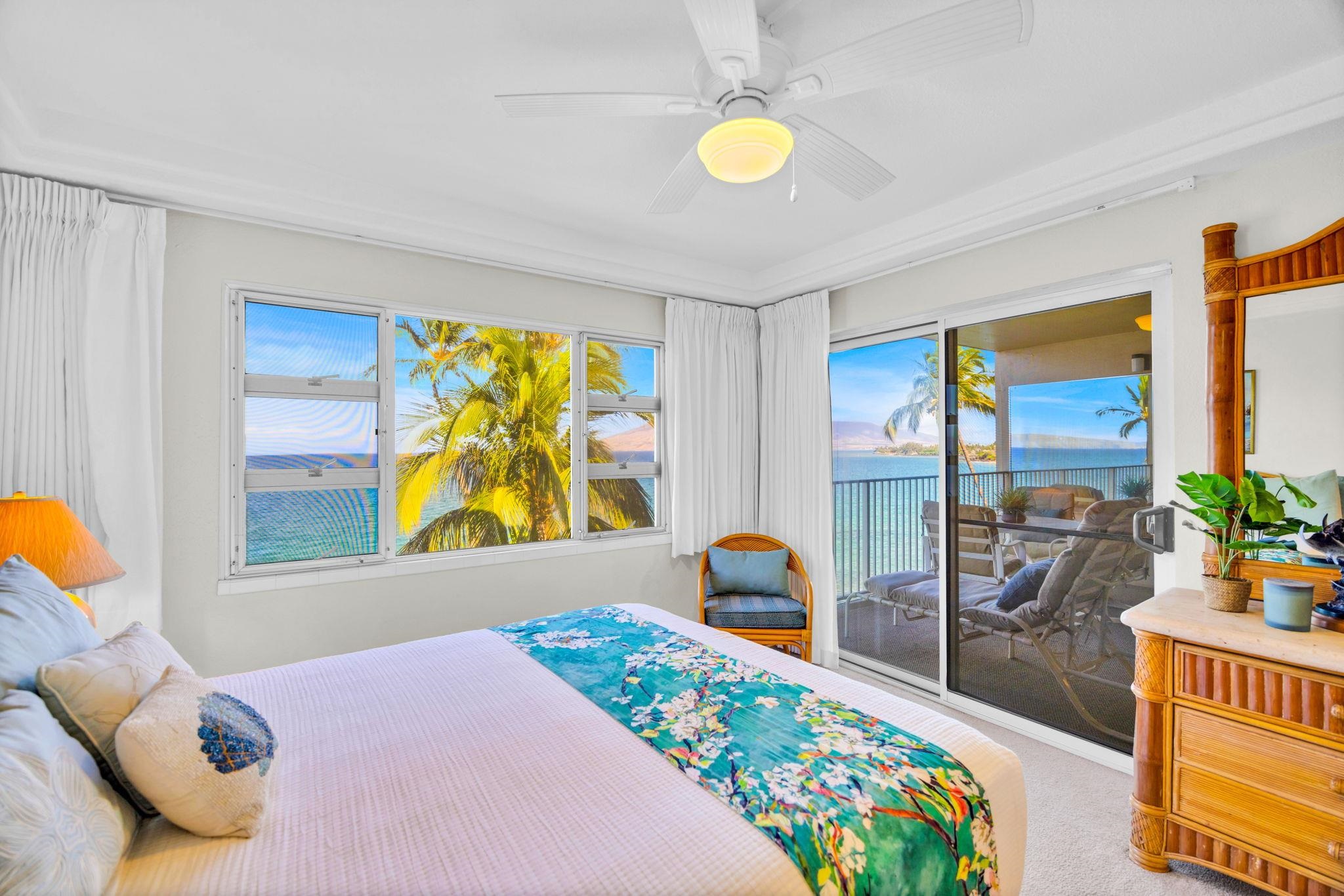 2430 South Kihei Road, Unit 515 Kihei, HI 96753 - Photo 23 of 50 a bedroom with a bed and a large window