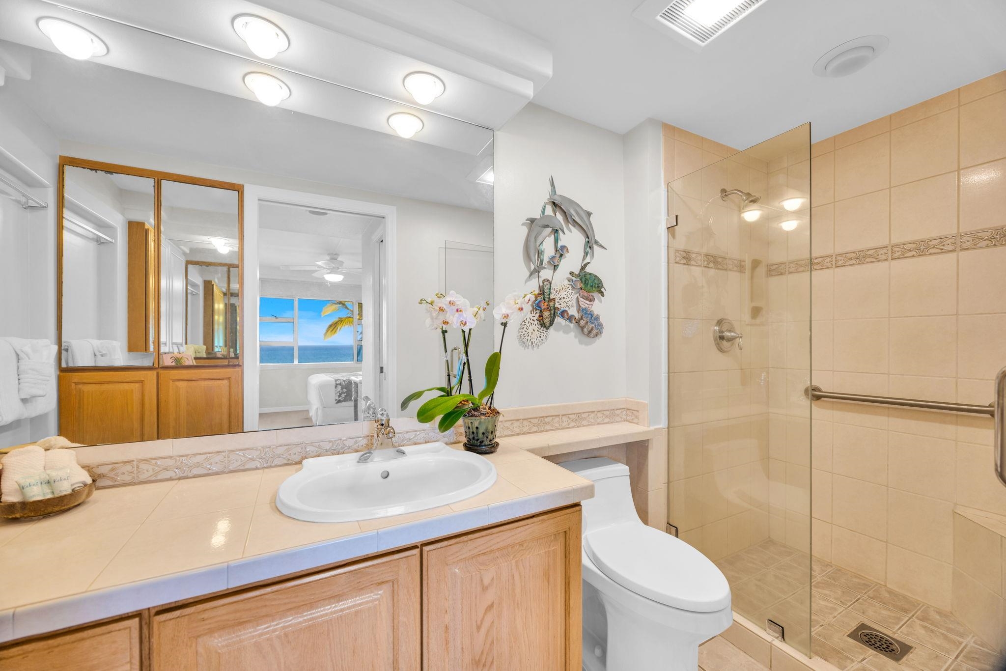 2430 South Kihei Road, Unit 515 Kihei, HI 96753 - Photo 30 of 50 a bathroom with a granite countertop sink a toilet and shower