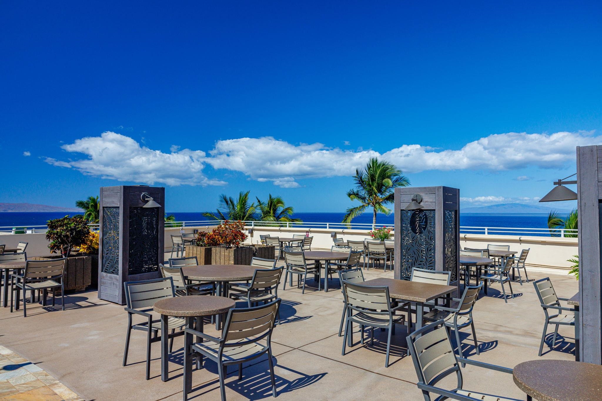 2430 South Kihei Road, Unit 515 Kihei, HI 96753 - Photo 43 of 50 a view of a dining room with furniture and chandelier