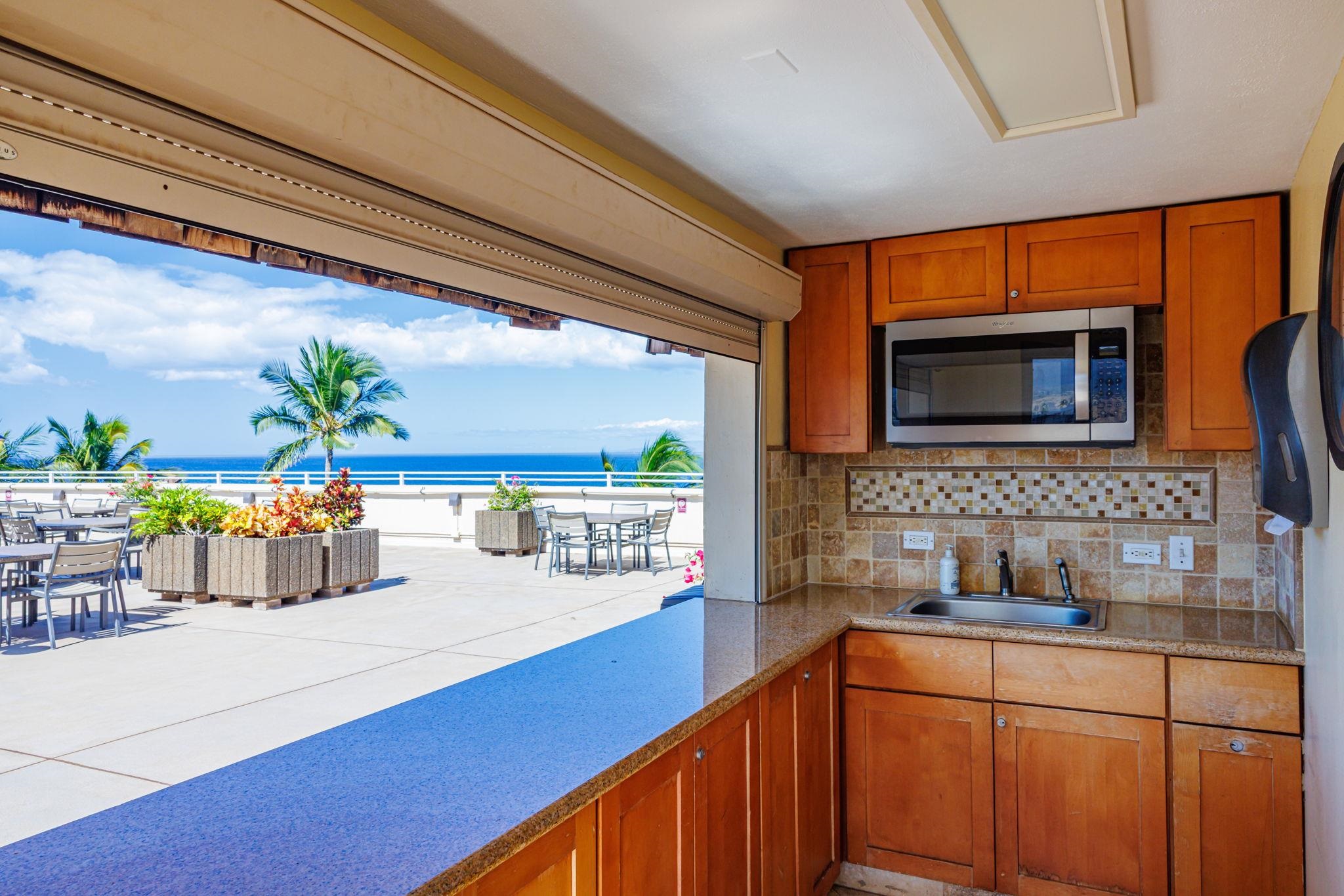2430 South Kihei Road, Unit 515 Kihei, HI 96753 - Photo 46 of 50 a kitchen with a potted plant on the counter and a sink