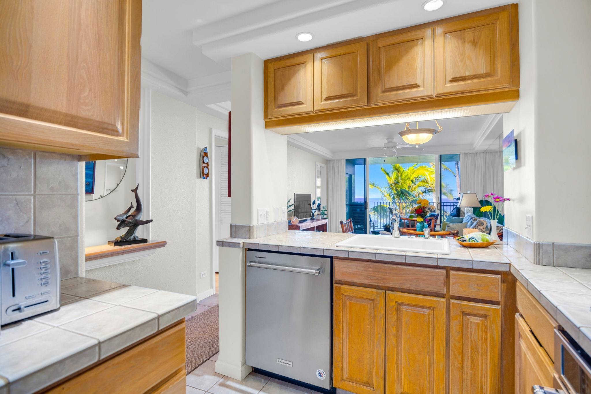 2430 South Kihei Road, Unit 515 Kihei, HI 96753 - Photo 8 of 50 a kitchen with stainless steel appliances granite countertop a sink and cabinets