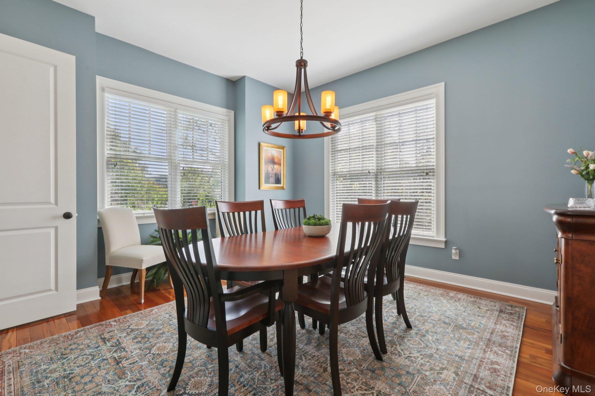 21 Long House Road Warwick, NY 10990 - Photo 15 of 50 a dining room with furniture wooden floor and a chandelier