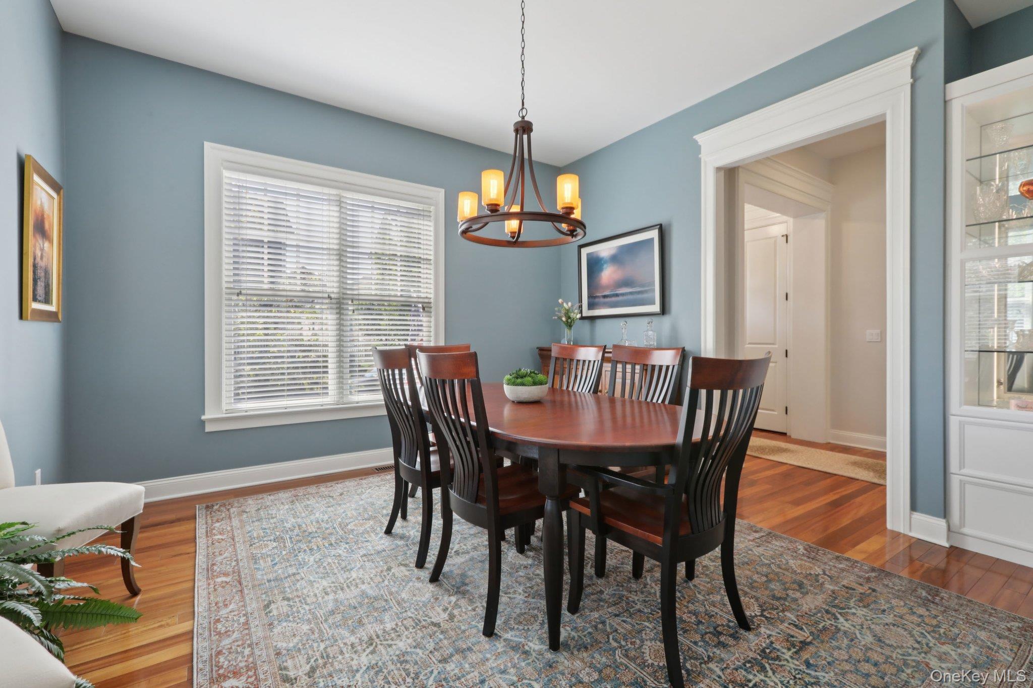 21 Long House Road Warwick, NY 10990 - Photo 16 of 50 a dining room with furniture a chandelier and wooden floor