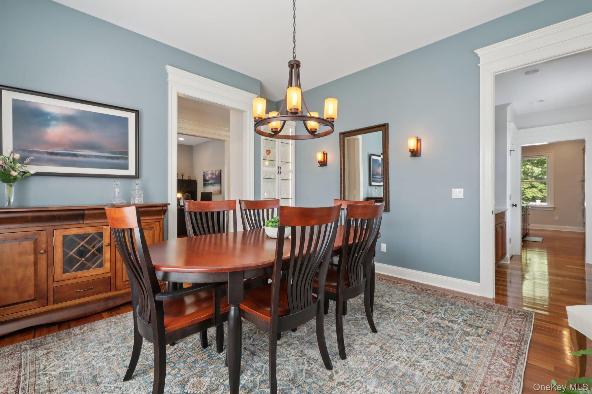 21 Long House Road Warwick, NY 10990 - Photo 17 of 50 a dining room with furniture a chandelier and wooden floor