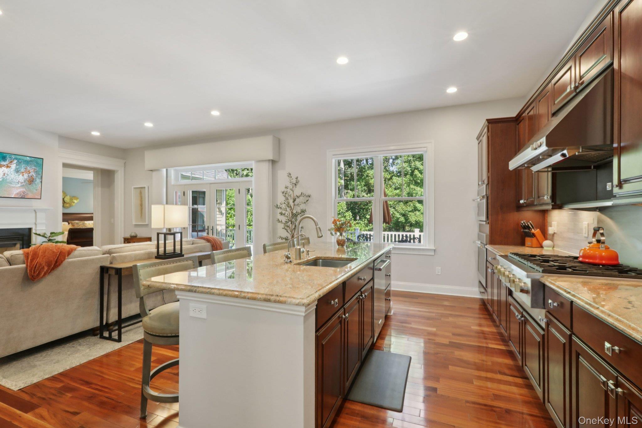 21 Long House Road Warwick, NY 10990 - Photo 18 of 50 a kitchen with stainless steel appliances granite countertop a stove oven a sink dishwasher and cabinets with wooden floor