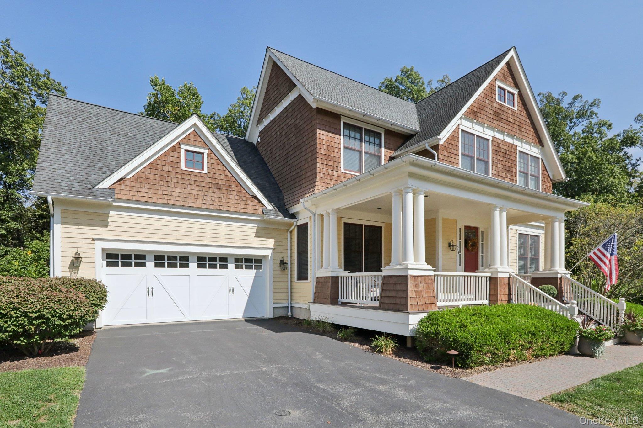 21 Long House Road Warwick, NY 10990 - Photo 2 of 50 a front view of a house with a yard and garage
