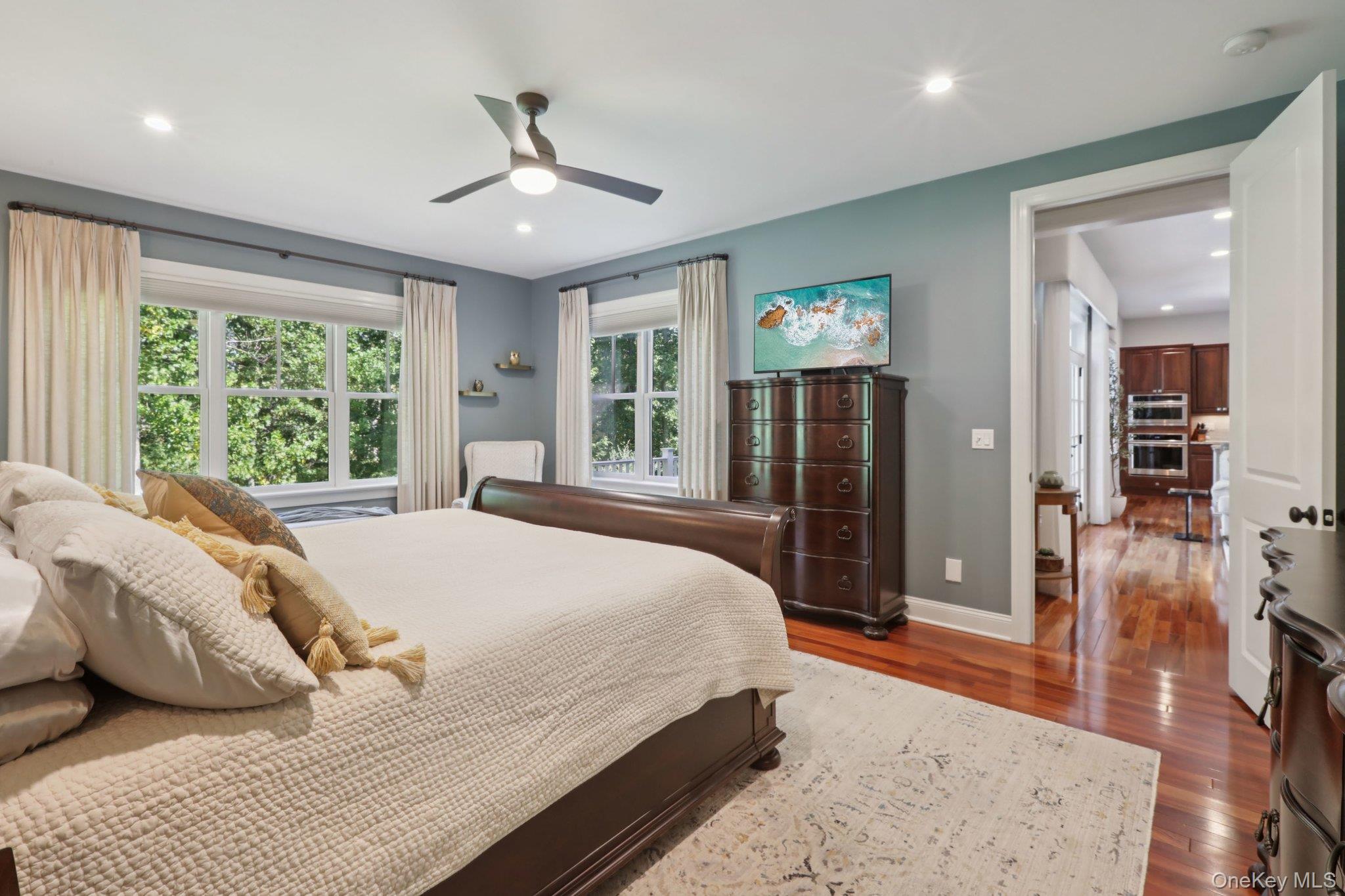 21 Long House Road Warwick, NY 10990 - Photo 26 of 50 a bedroom with a large bed a flat tv screen and a dresser