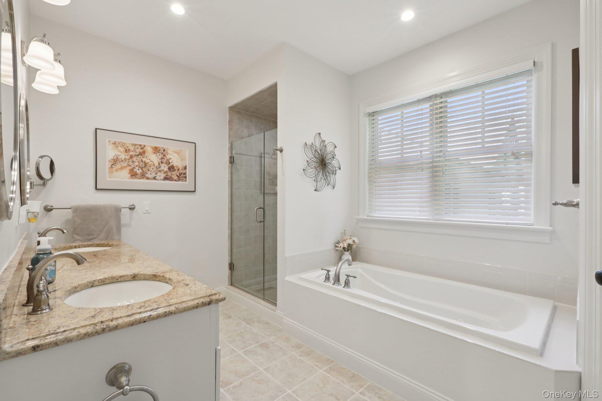 21 Long House Road Warwick, NY 10990 - Photo 28 of 50 a bathroom with a granite countertop tub a sink and a window