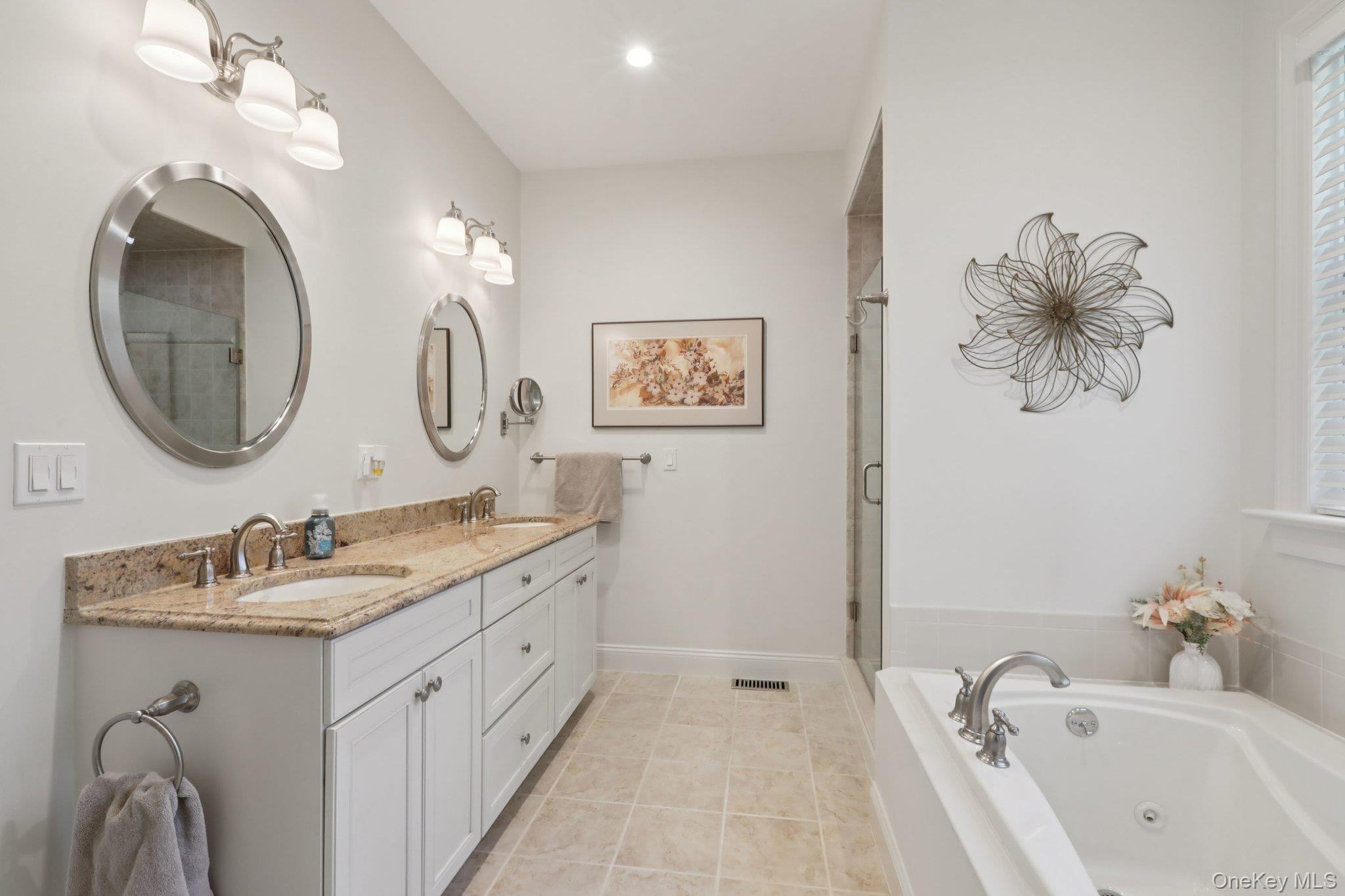 21 Long House Road Warwick, NY 10990 - Photo 29 of 50 a bathroom with a double vanity sink a mirror and a bathtub