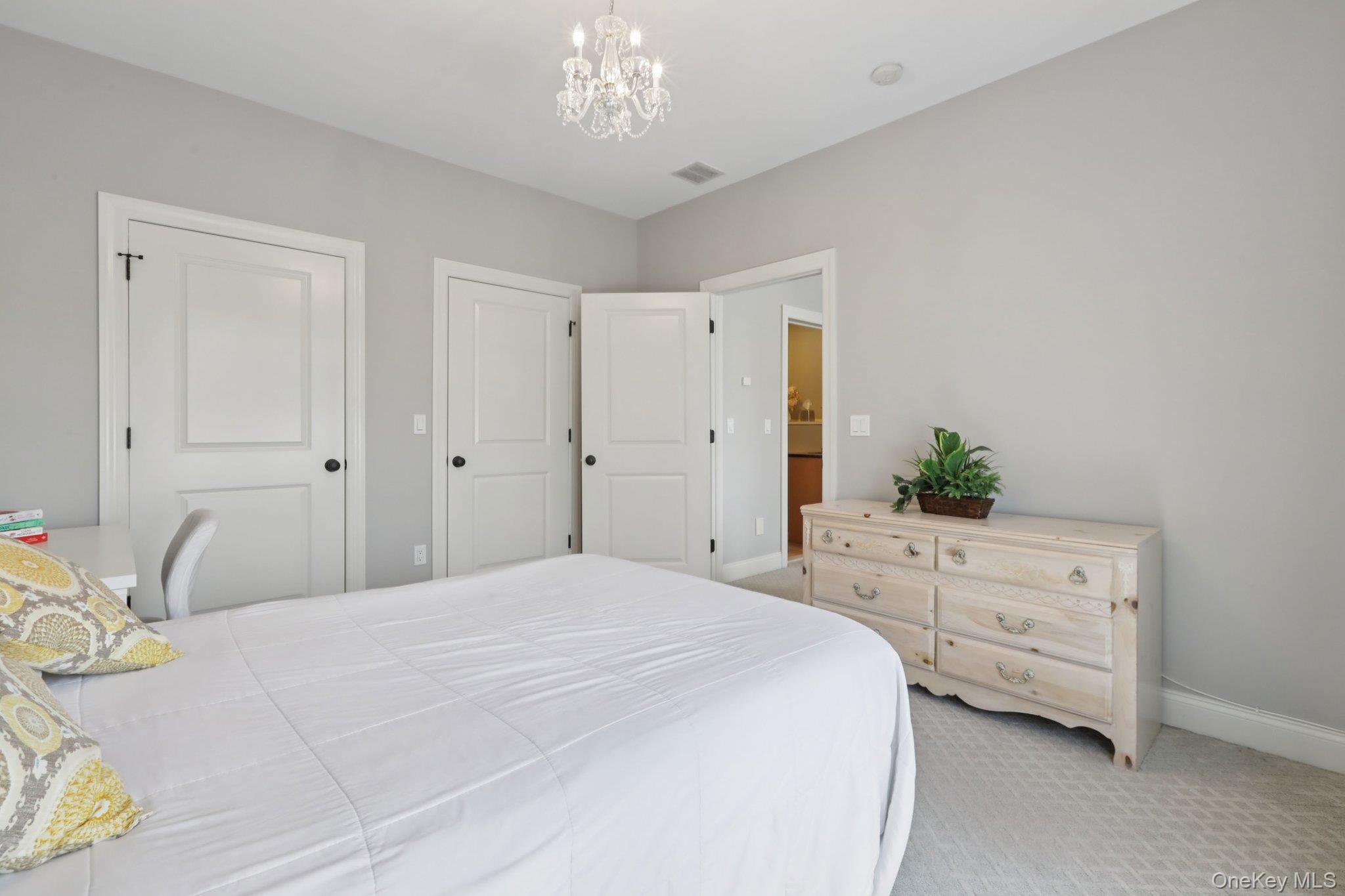21 Long House Road Warwick, NY 10990 - Photo 38 of 50 a spacious bedroom with a bed and a dresser