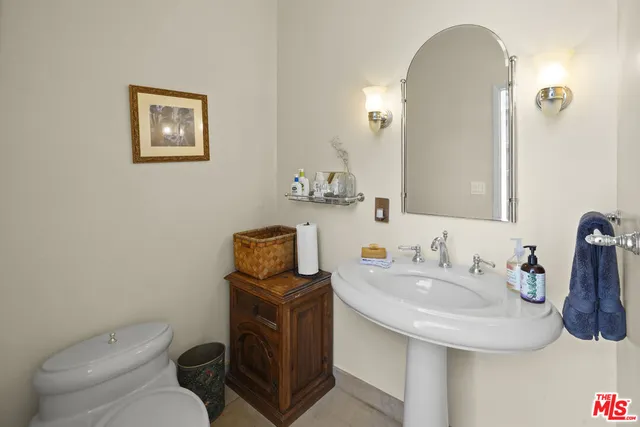 a large bed in a white room