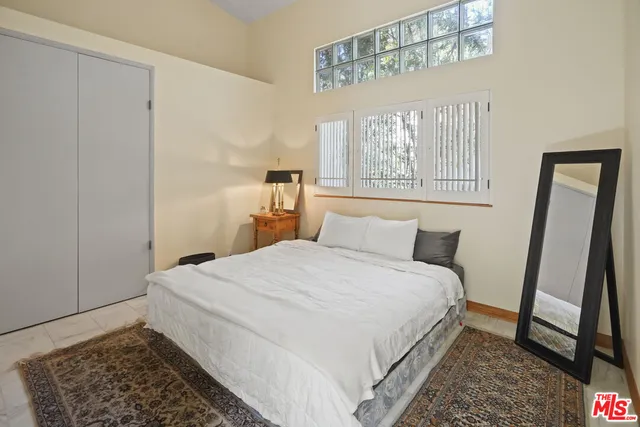 a bathroom with a toilet a sink and shower