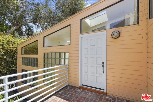 a view of an ocean beach and mountain