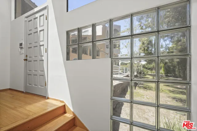 a view of a yard with snow on the road