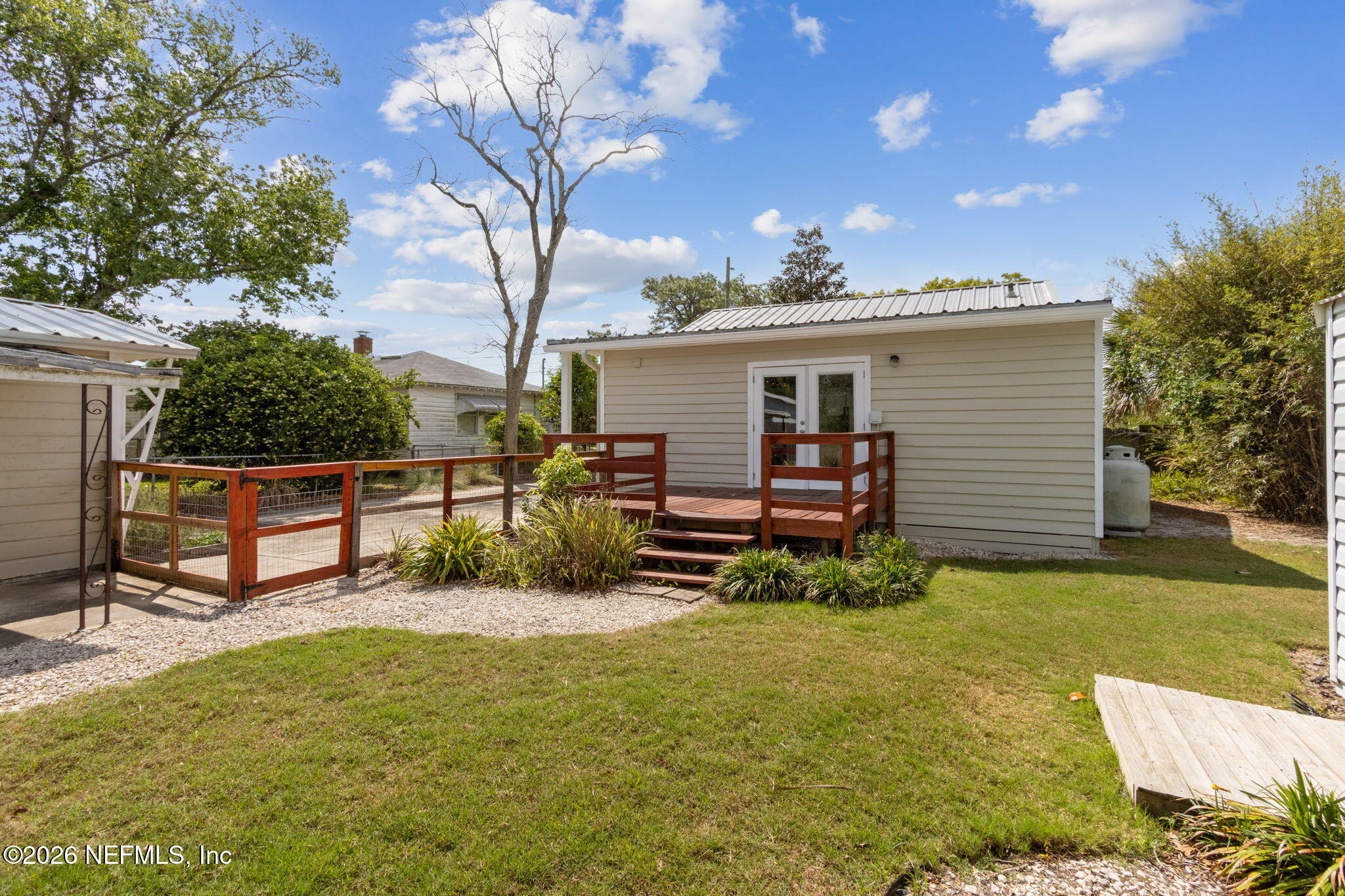 4649 Cambridge Road Jacksonville, FL 32210 - Photo 11 of 24 a view of a chairs in backyard of house