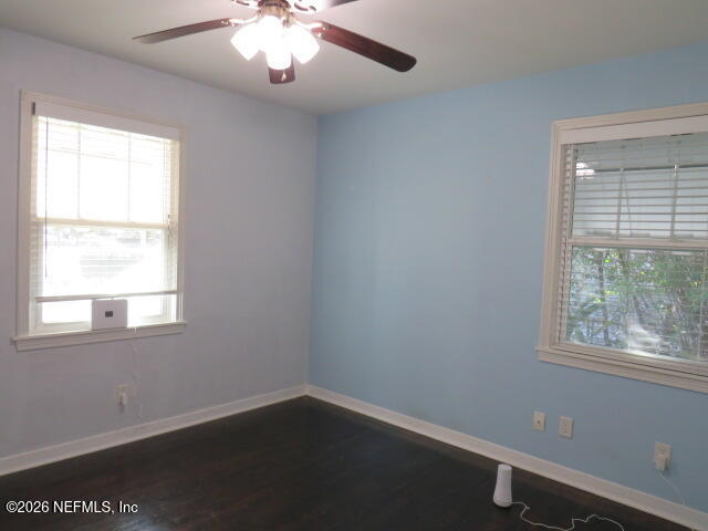 4649 Cambridge Road Jacksonville, FL 32210 - Photo 12 of 24 an empty room with a window