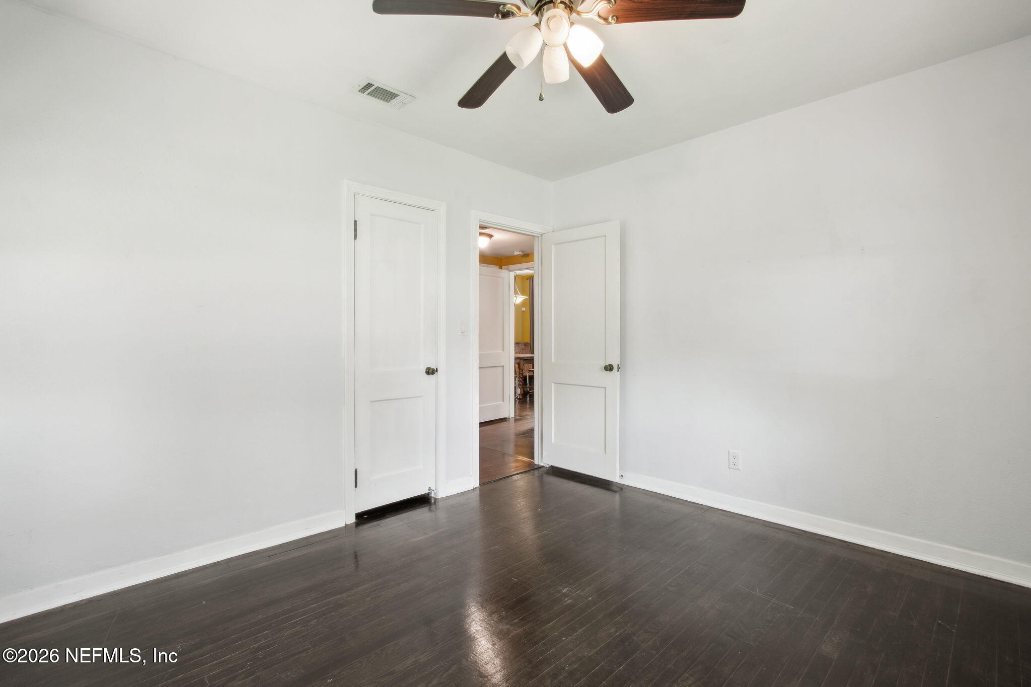 4649 Cambridge Road Jacksonville, FL 32210 - Photo 13 of 24 wooden floor in an empty room
