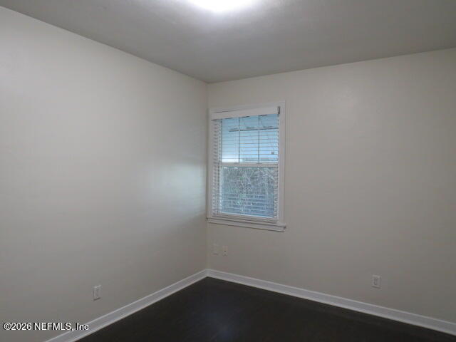 4649 Cambridge Road Jacksonville, FL 32210 - Photo 14 of 24 an empty room with a window