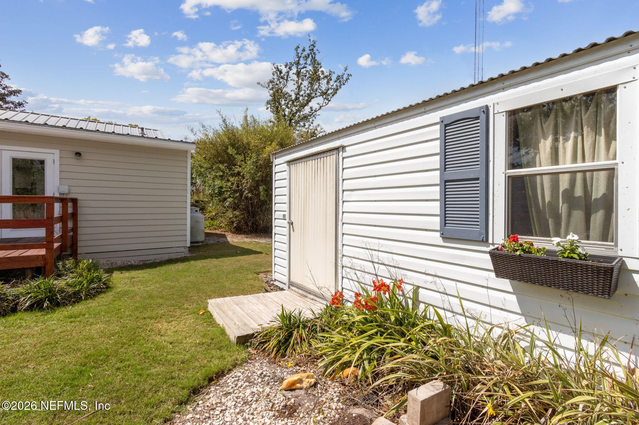 4649 Cambridge Road Jacksonville, FL 32210 - Photo 19 of 24 a front view of a house with garden