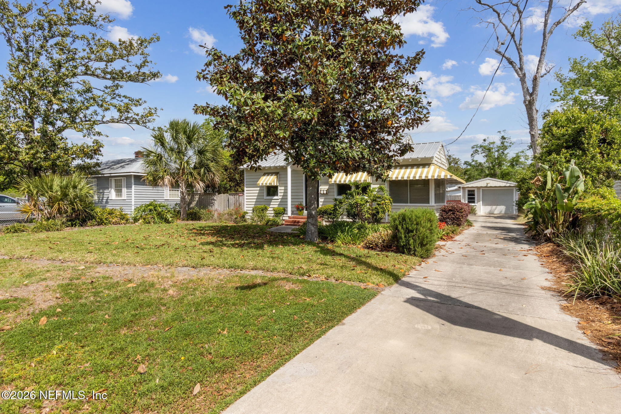 4649 Cambridge Road Jacksonville, FL 32210 - Photo 22 of 24 a front view of a house with a yard