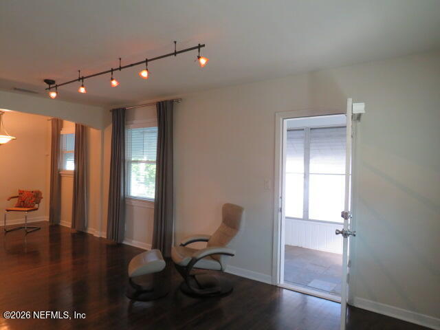 4649 Cambridge Road Jacksonville, FL 32210 - Photo 5 of 24 a view of a hallway with wooden floor and furniture