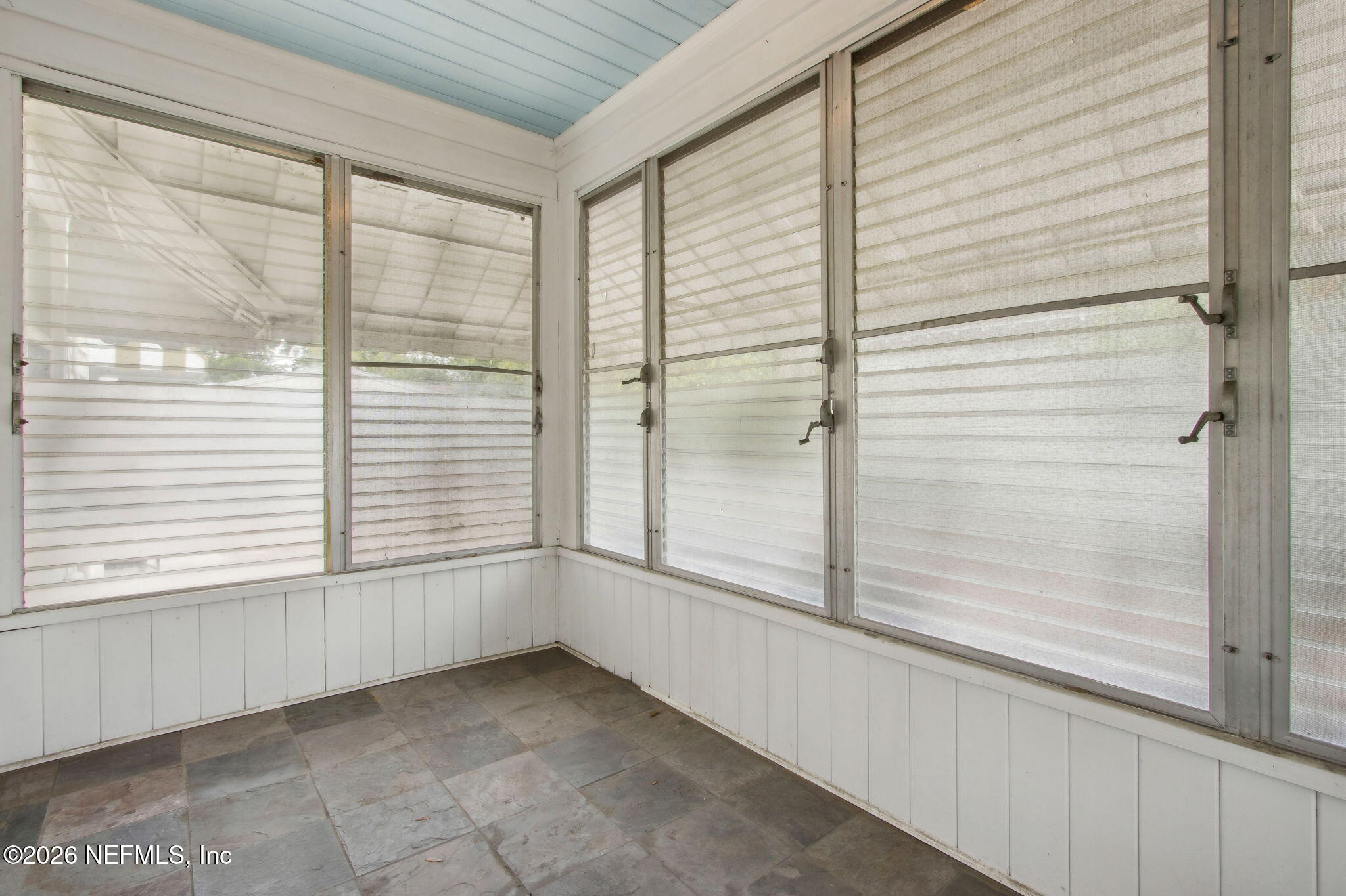 4649 Cambridge Road Jacksonville, FL 32210 - Photo 6 of 24 a view of an empty room and window