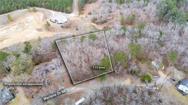 a view of a wooden fence with a yard
