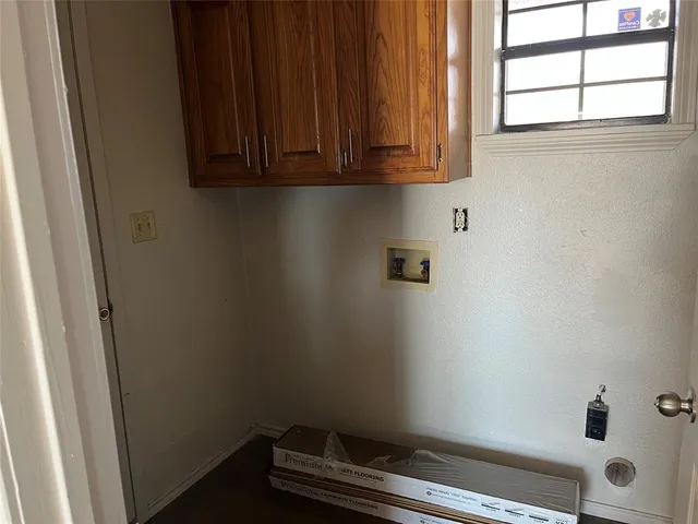 a bathroom with a window and a shower