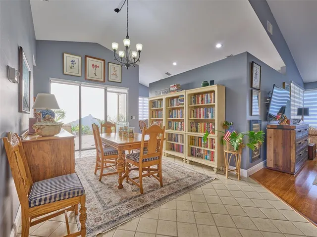 a dining room with furniture and window