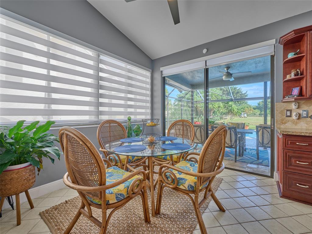 19284 Cherry Hills Terrace Boca Raton, FL 33498 - Photo 15 of 45 a dining room with furniture and window
