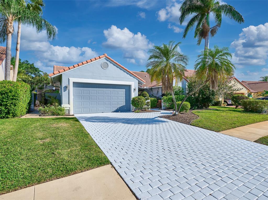 19284 Cherry Hills Terrace Boca Raton, FL 33498 - Photo 2 of 45 a front view of house with yard and green space