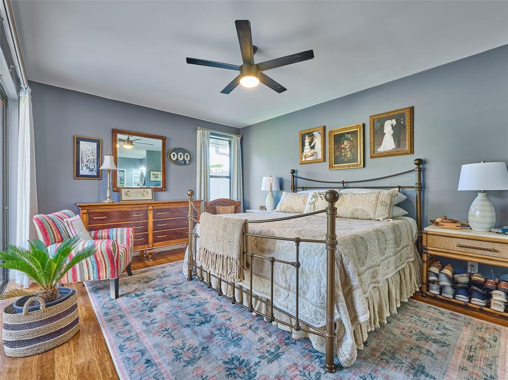 19284 Cherry Hills Terrace Boca Raton, FL 33498 - Photo 21 of 45 a bedroom with a bed table and a window