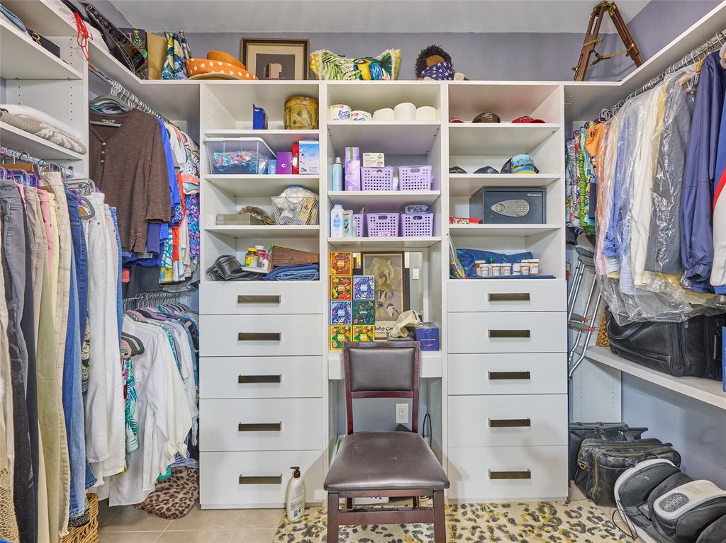 19284 Cherry Hills Terrace Boca Raton, FL 33498 - Photo 22 of 45 a view of walk in closet with clothes and shoes
