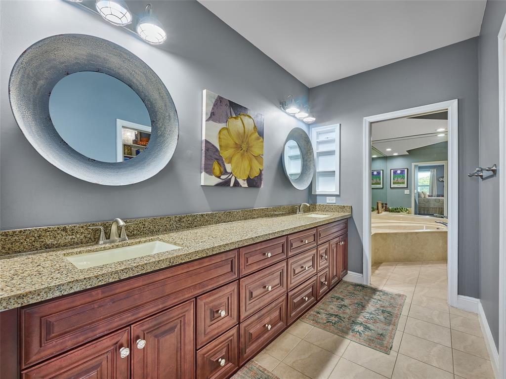 19284 Cherry Hills Terrace Boca Raton, FL 33498 - Photo 23 of 45 a bathroom with a granite countertop sink and a mirror