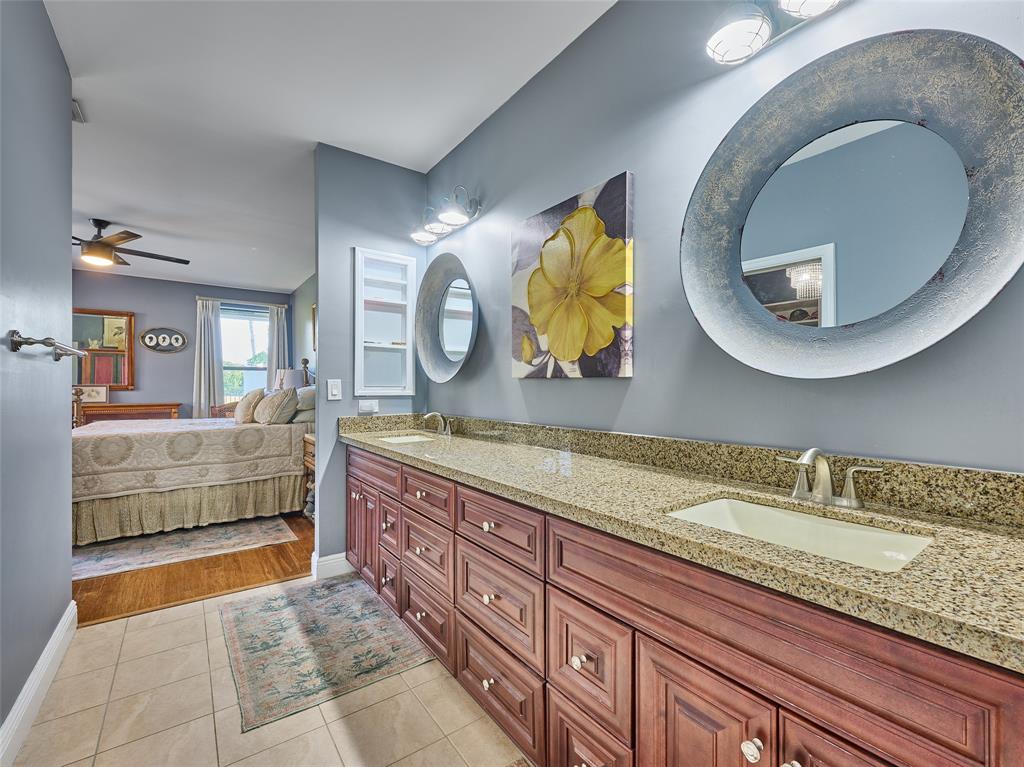 19284 Cherry Hills Terrace Boca Raton, FL 33498 - Photo 24 of 45 a bathroom with a granite countertop sink and a mirror