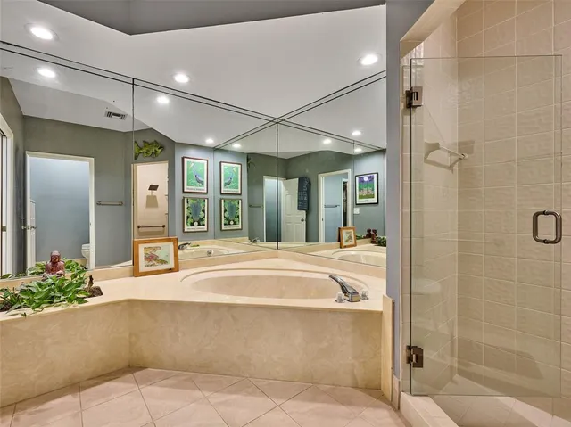 a bathroom with a tub and shower