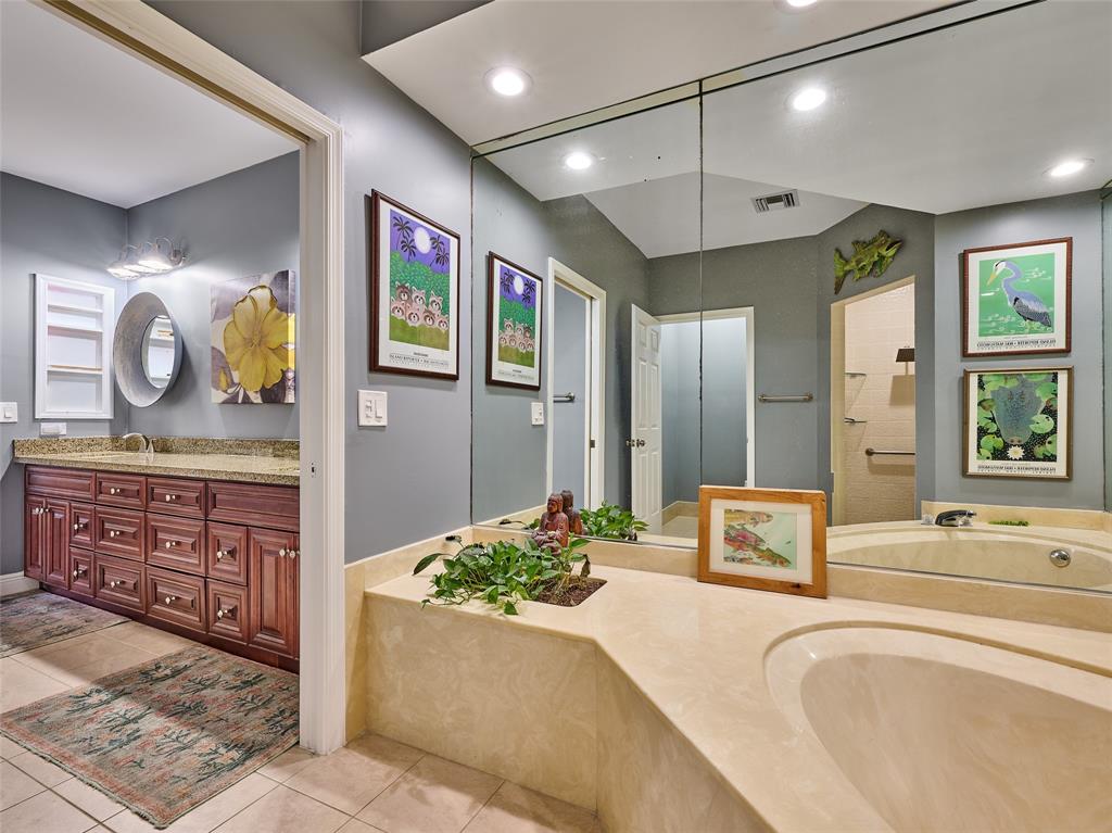 19284 Cherry Hills Terrace Boca Raton, FL 33498 - Photo 27 of 45 a spacious bathroom with a tub sink and mirror