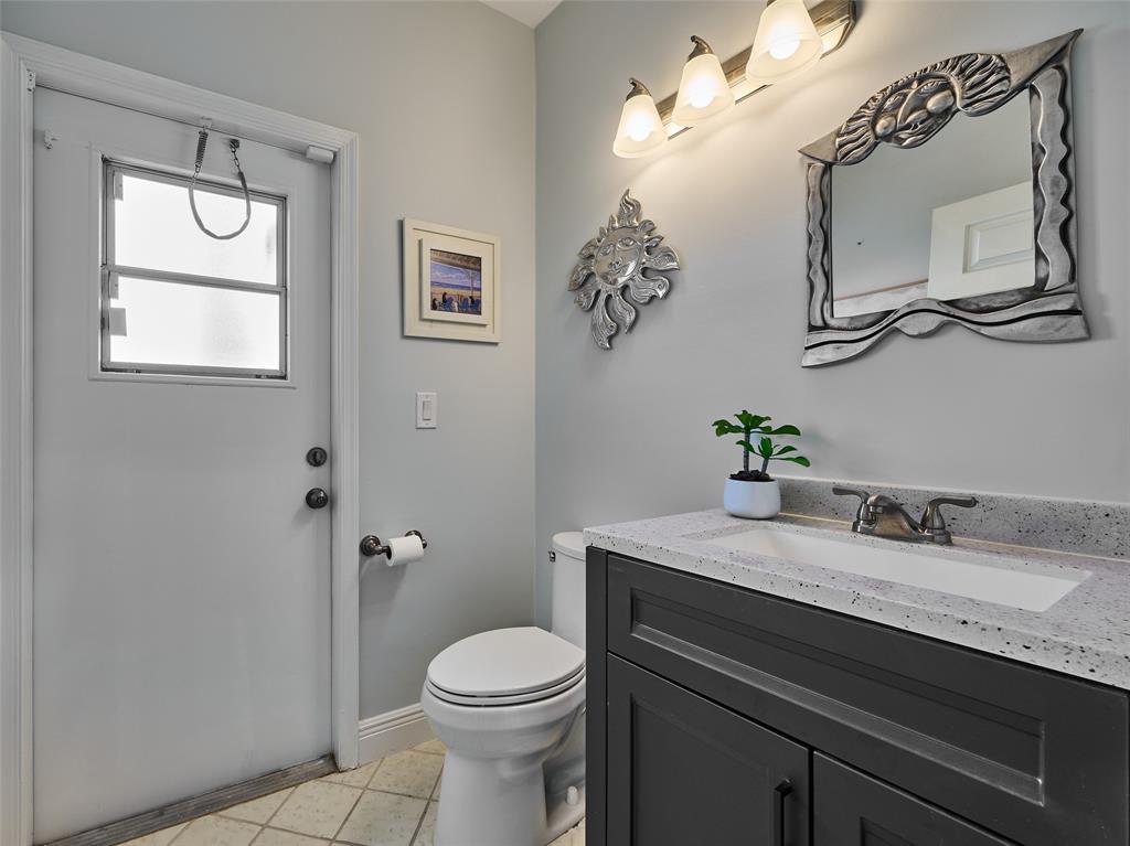 19284 Cherry Hills Terrace Boca Raton, FL 33498 - Photo 28 of 45 a bathroom with a granite countertop sink mirror vanity and toilet