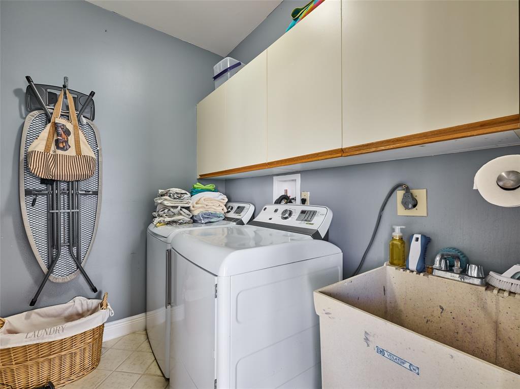 19284 Cherry Hills Terrace Boca Raton, FL 33498 - Photo 29 of 45 a utility room with dryer and washer
