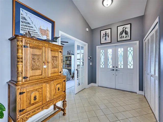 a view of a hallway with entryway door