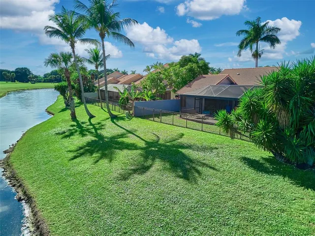 a garden with a tree in front of it