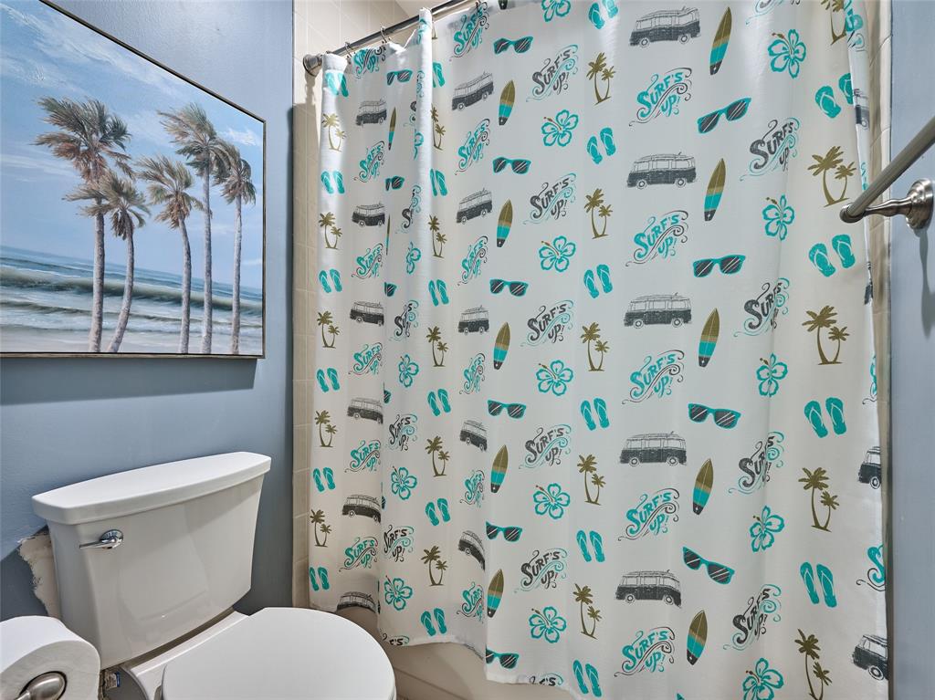 19284 Cherry Hills Terrace Boca Raton, FL 33498 - Photo 8 of 45 a white toilet sitting next to a shower curtain