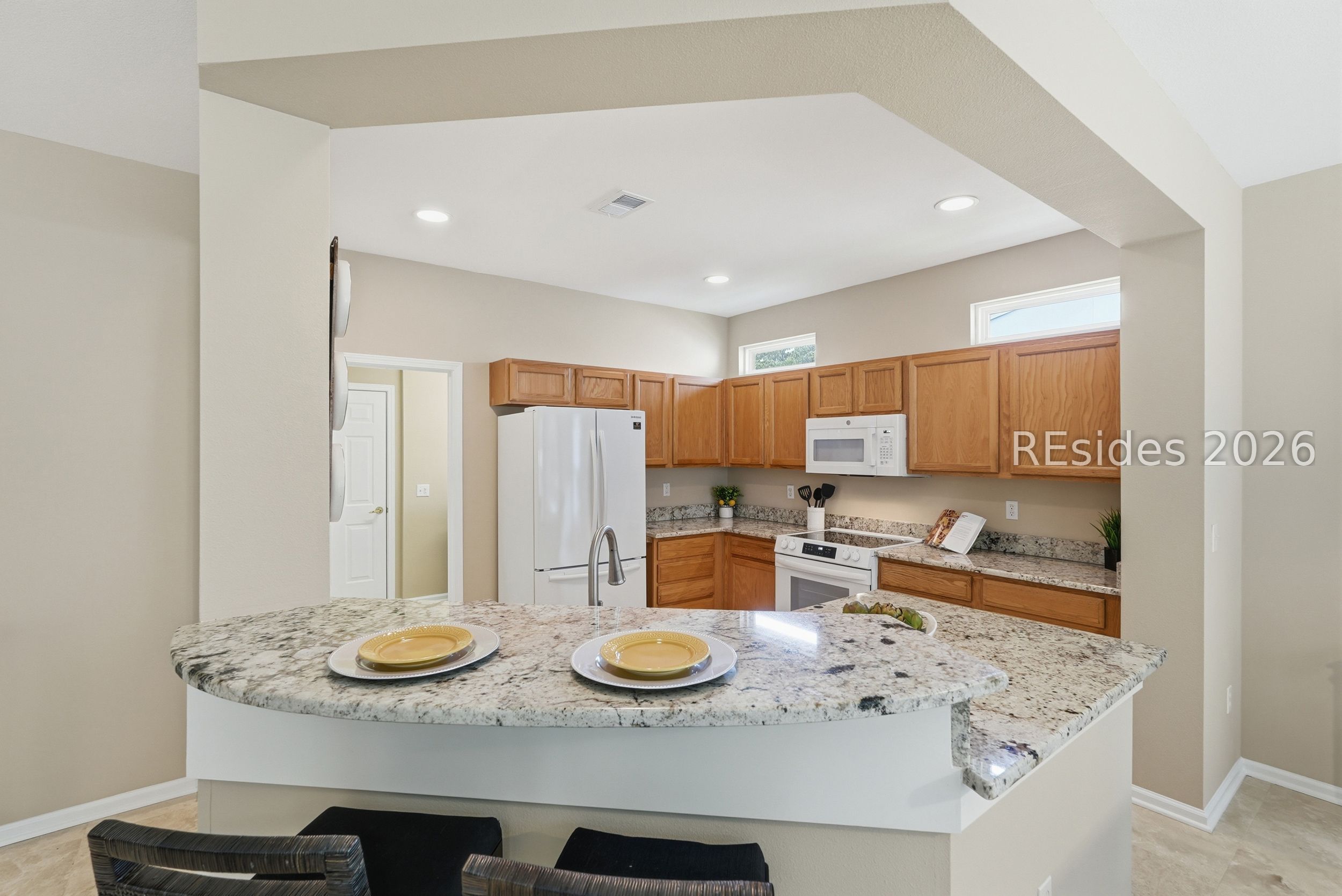 189 Hampton Circle Bluffton, SC 29909 - Photo 10 of 66 Kitchen bar area adds extra space for entertaining