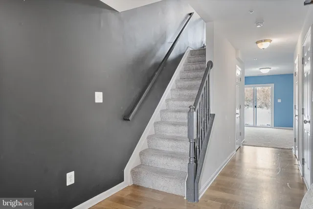 a view of a hallway with staircase