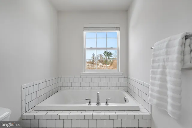 a living room with furniture and window