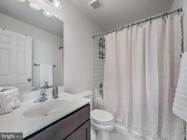 an aerial view of multiple houses with outdoor space