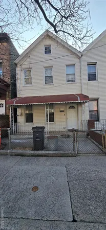 a view of a house with a yard and garage
