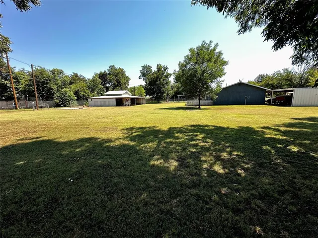 a view of a swimming pool with an outdoor space and seating area