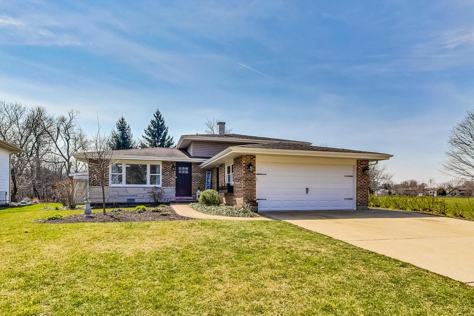 837 Foster Avenue Bartlett, IL 60103 - Photo 1 of 46 a front view of a house with a yard and garage